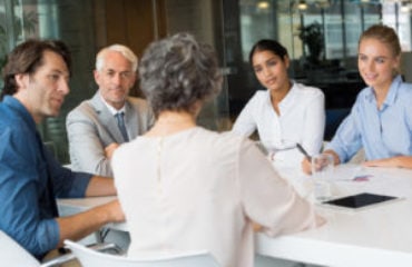 group coaching at conference table