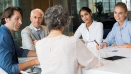 group coaching at conference table